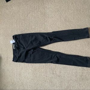 Size 28 Levi skinny jeans. Black with rips.
